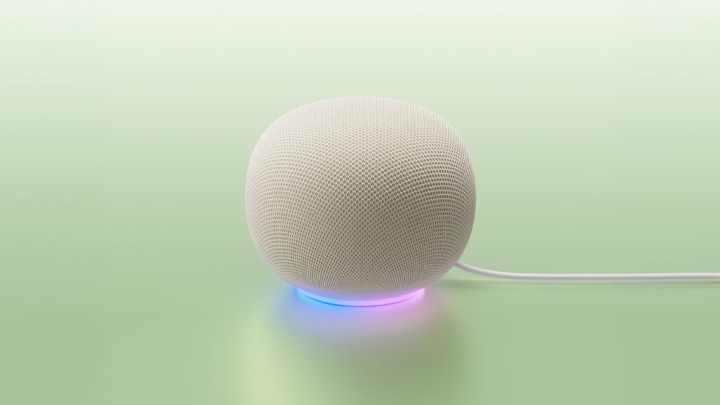 Google Home speaker designed for Gemini on a pale green background