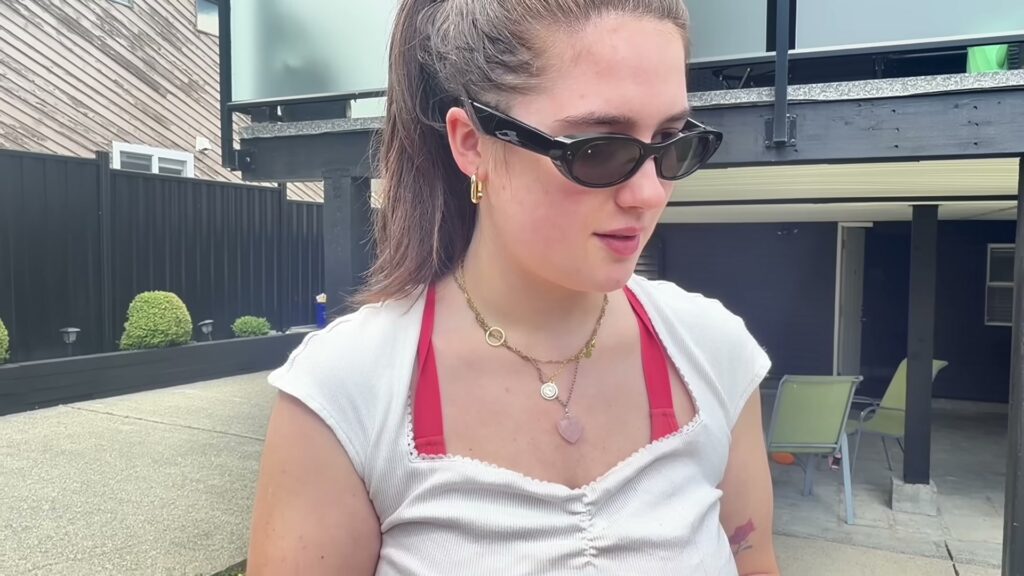 Sienna wearing Meta Starfire Kylie Edition glasses during the French and English sequence in Kingy's review