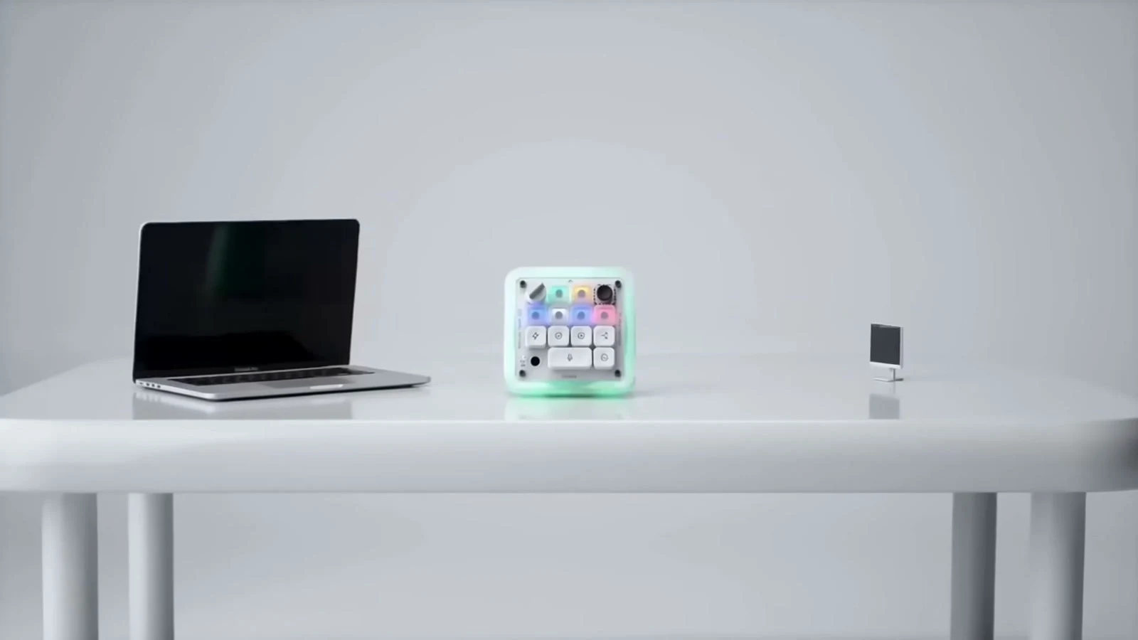 Codex Micro RGB agent keys beside a laptop running the ChatGPT Codex desktop app