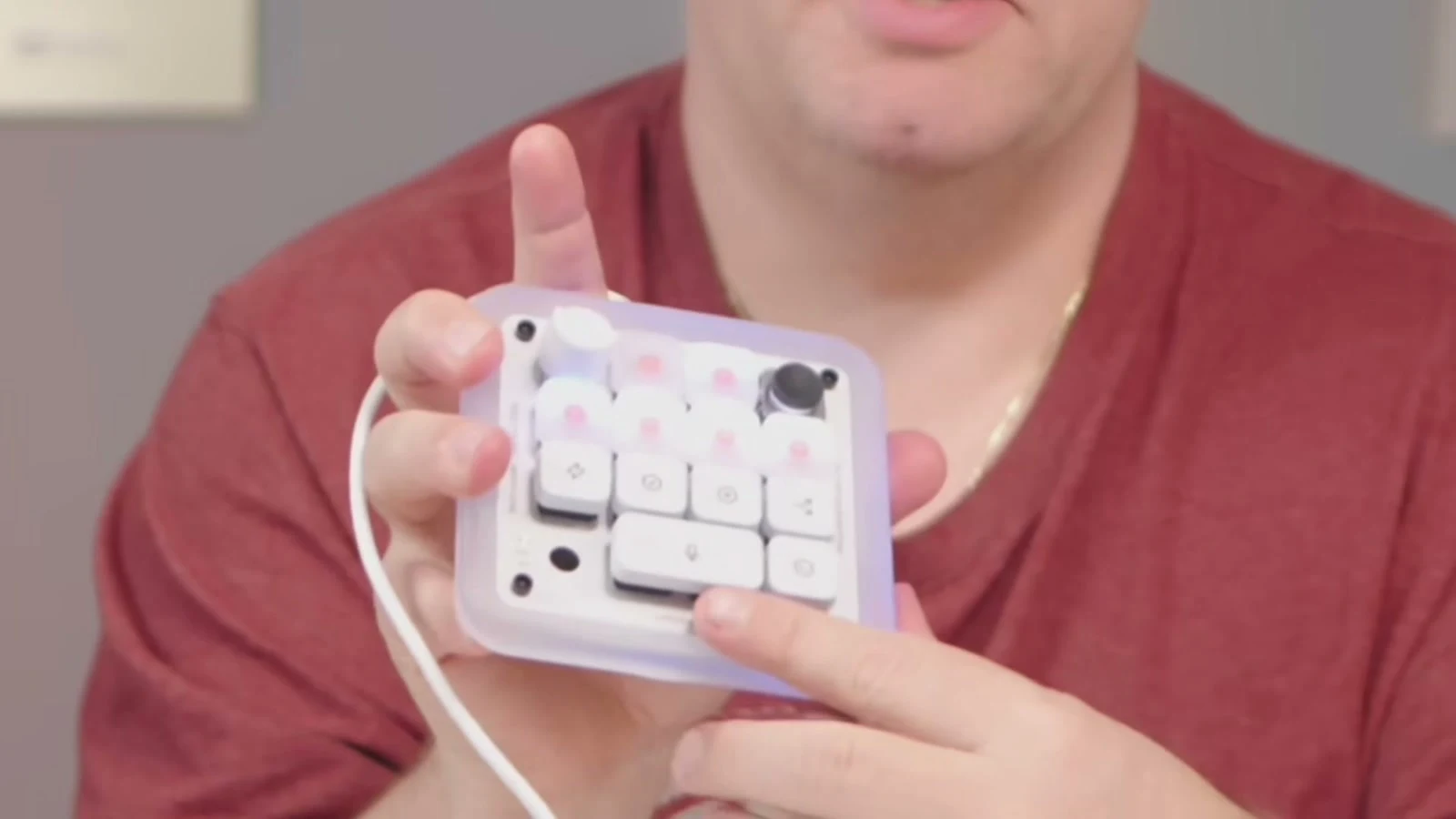 Curtis Pyke holding the Codex Micro and pressing a mechanical command key
