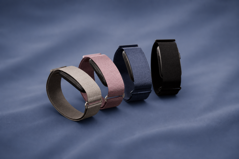 Four Garmin Cirqa screenless fitness bands in grey, mauve, blue and black